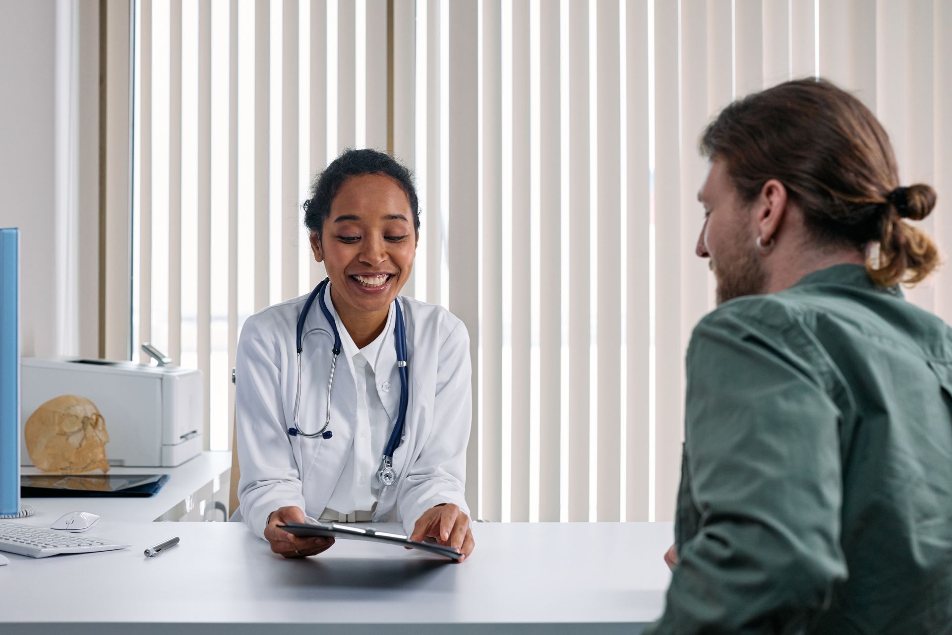 Doctor consulting with patient about health insurance